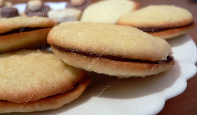 Coconut cookie and chocolate ganache sandwiches