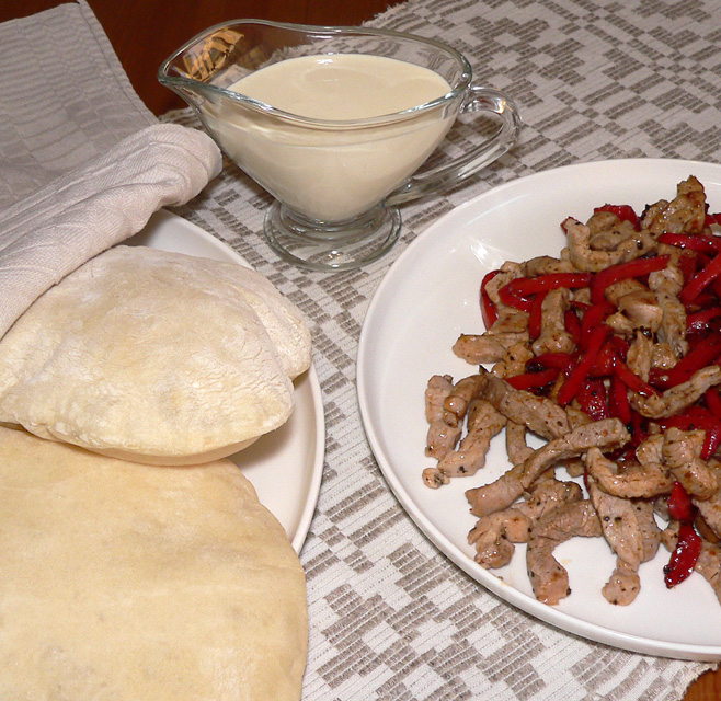 Peppered pork pitas with garlic spread