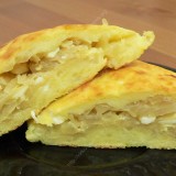 Boiled potato pancakes with cabbage filling