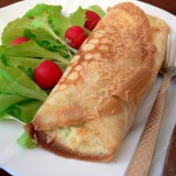 Crepes stuffed with broccoli and cheese